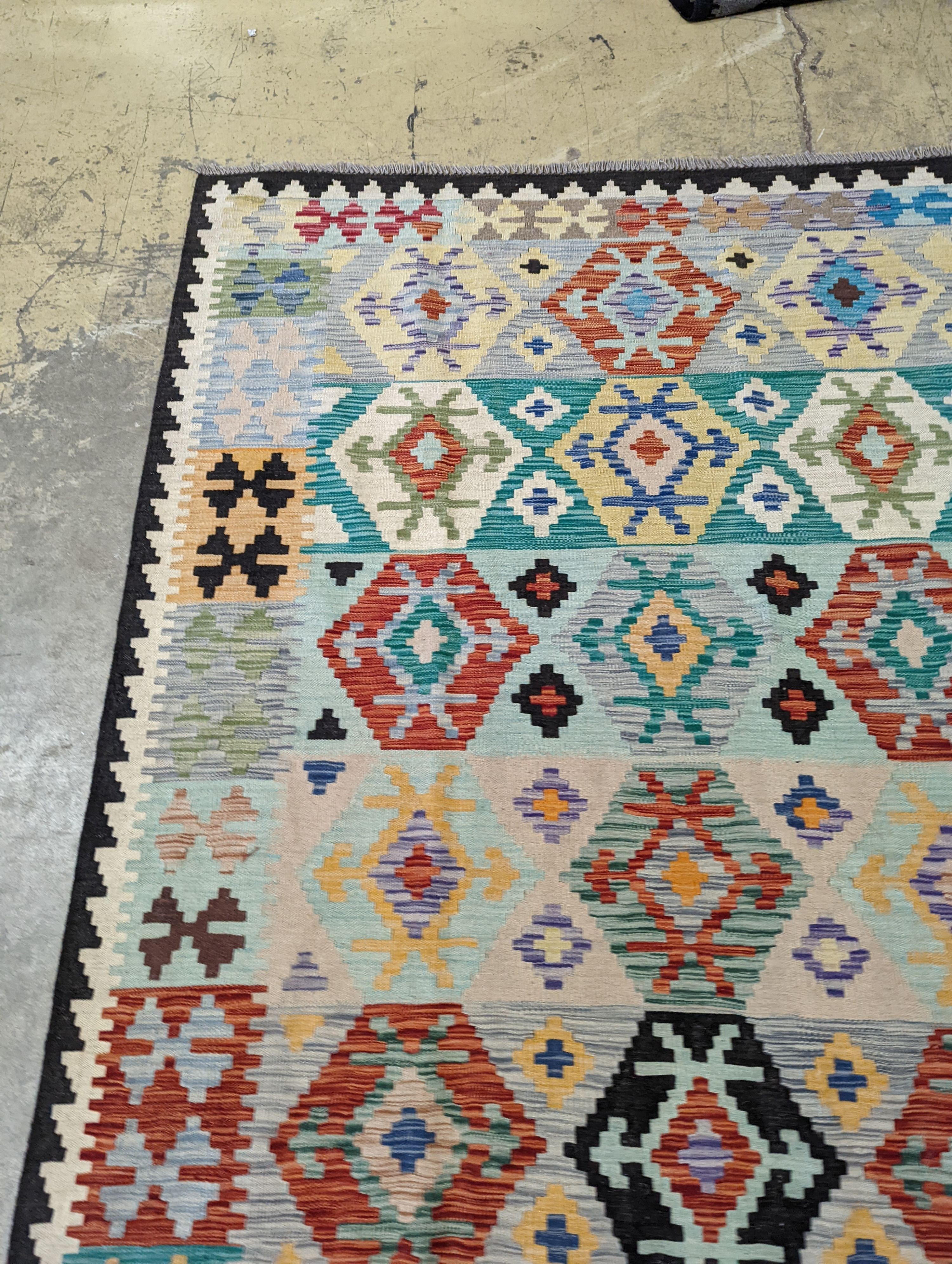 An Anatolian contemporary Kelim polychrome flatweave carpet, 300 x 204cm